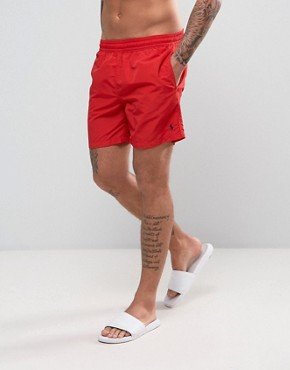 Thanks to Baywatch, red swim shorts will never go out of fashion.